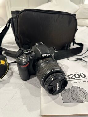 Nikon DSLR Camera in Black with Lens and Strap